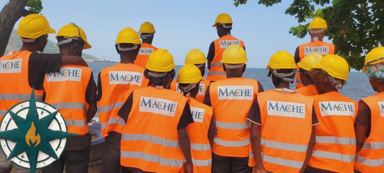 MACHE Community together at the water's edge — the team behind Konbit Okap.