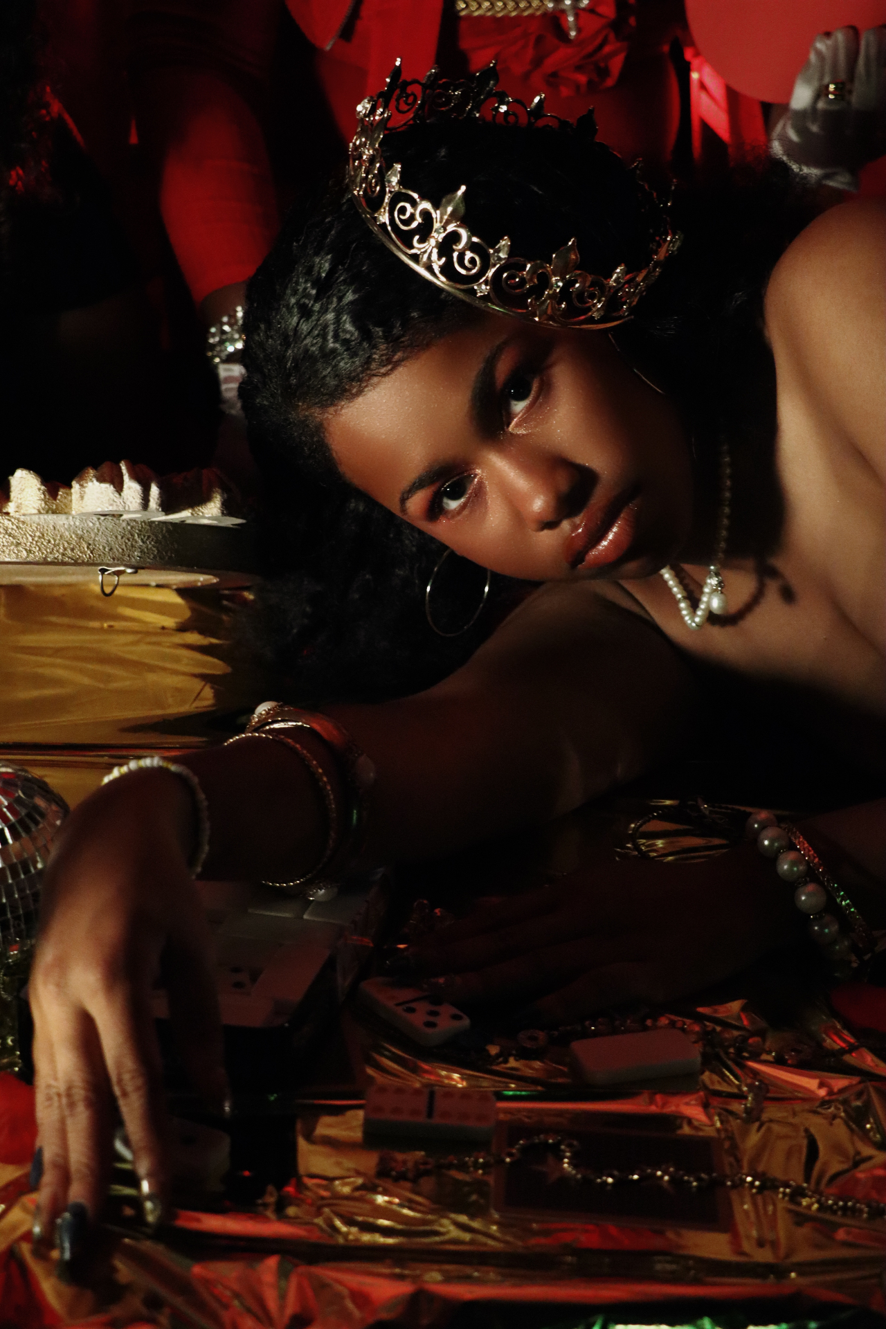 Crown, dominoes, gold foil — treasures of the queen.